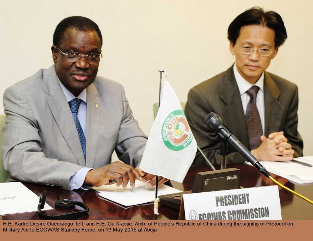 H.E. Kadre Desire Ouedraogo, left, making statement and H.E. Gu Xiaojie, Amb. of People's Republic of China during Signing of Protocol on Military Aid Gratis to ECOWAS, 13 May 2015 IMS90