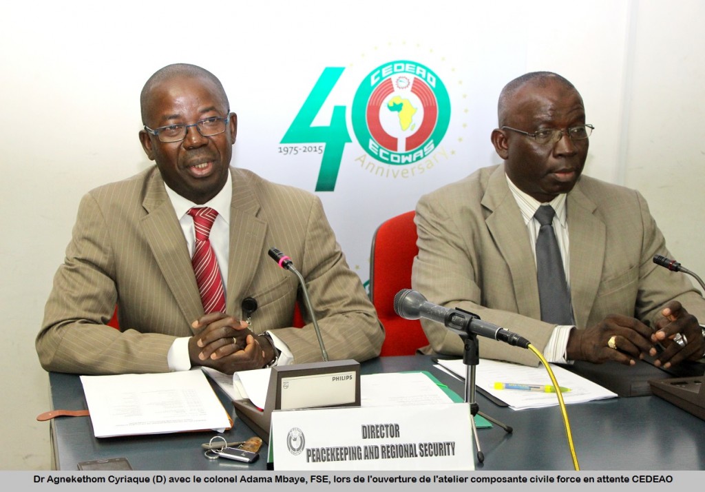 Dr. Agnekethom Cyriaque(L) with Col. Adama Mbaye, ESF,   during opening of Validation workshop on Civilian Dimention Policy   Framework. 30 july 2015.G_9836